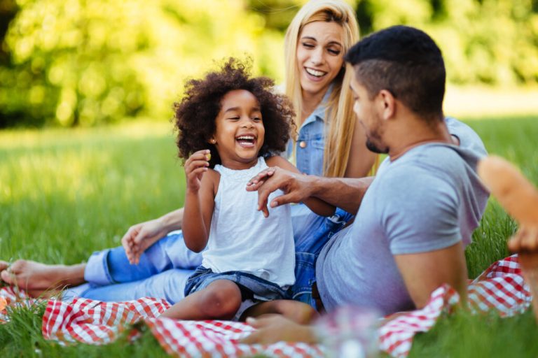 Man and wife with their daughter in the park